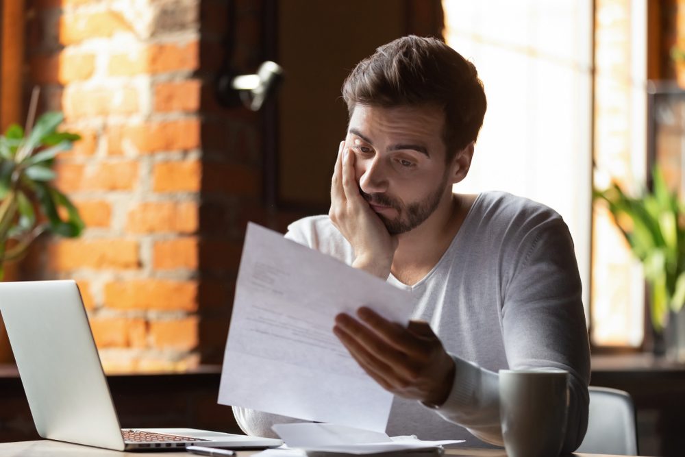 Investor reviewing financing documents at desk